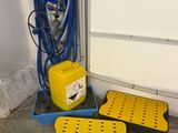 two yellow and black boxes with a blue hose and a yellow container