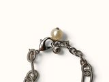 silver bracelet with a pearl bead and a chain link