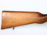 an old wooden rifle with a wooden barrel on a white background