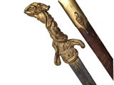 une image représentant une épée ornée d'une tête de lion