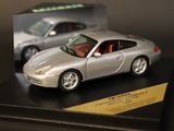 a silver model of a sports car on display