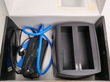 a box that has a charger and a cable in it