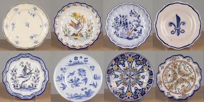 several plates with blue and white designs on them on a table