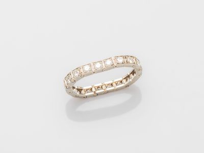 a white gold ring with diamonds on a white background