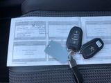 a picture of a car key and car keys on top of a checkbook