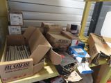 many boxes of assorted items sitting on a shelf