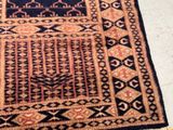 an image of a rug on the floor with a cat sleeping on it