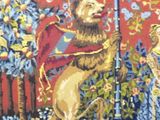 a tapestry with a picture of a man and a dog on it