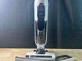 an image of a cordless mop sitting on top of a wooden table