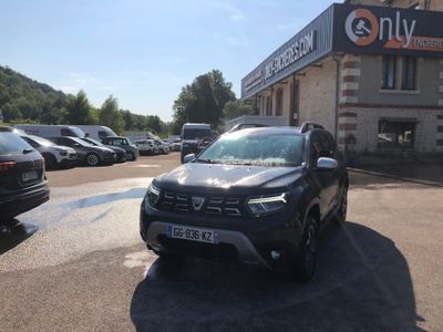 a black car parked in front of a building