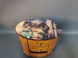 a small wooden box with a picture on it