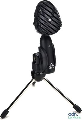 a close up of a microphone on a tripod on a white background