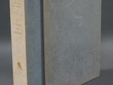 the book is open and sitting on a gray surface
