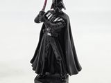 a close up of a darth vader figurine on a white background
