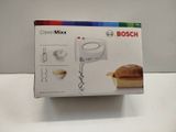 packaging of a box with a mixer and a sandwich inside of it