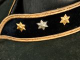a close up of a military hat with stars on it