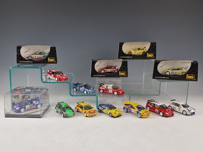 a lot of toy cars on display in a display case