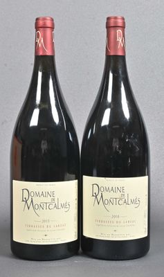two bottles of wine sitting next to each other on a table