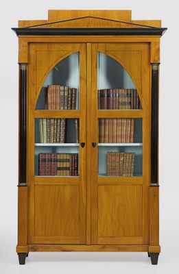 an image of a wooden bookcase with many books in it