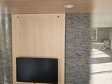 a television mounted on a wall in a room