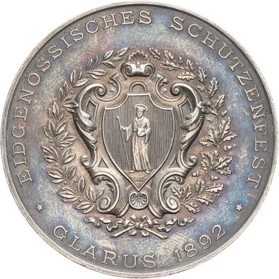 an image of a silver coin with a coat of arms on it