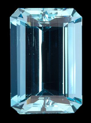 un gros plan d'un diamant bleu sur fond noir