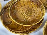 a lot of plates that are sitting on a table