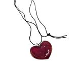 necklace with a red heart on a black cord on a white background
