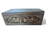 a black and gold box with a painting on it