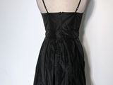 strapless black dress on a mannequin display on a mannequin stand
