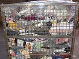 a metal cart with many items in it in a warehouse