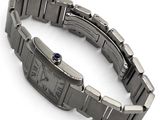 an image of a wrist watch with a blue stone in the center