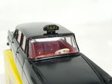 a black taxi cab with a yellow roof on a white background
