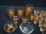 a lot of glasses and a bowl on the table