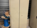 a cabinet that has a bunch of wires on top of it