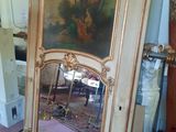 a mirror that is sitting on the floor in front of a mirror