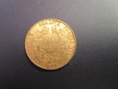 an image of a gold coin on a black surface