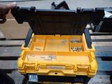 a yellow tool box that is sitting on a pallet