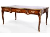 un bureau ancien à deux tiroirs et doté d'un plateau en marbre