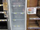 a refrigerator that is sitting in the middle of a store