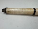 an old pipe that is sitting on a table