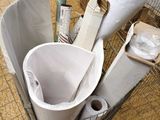 a basket full of toilet paper and toilet paper rolls