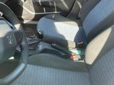 a car dashboard with a steering wheel and a seat belt