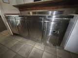 a stainless steel refrigerator and a refrigerator freezer in a kitchen
