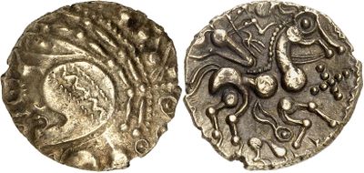 a close up of a coin with an image of a horse on it