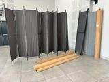 a room divider that has a bunch of boards on the floor