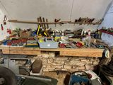 a workbench with many tools on it in a garage