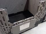 many plastic crates that are stacked on top of each other