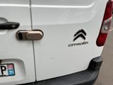 a close up of a white van with a chrome door handle