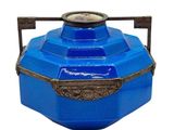 a blue container with a clock on top of it